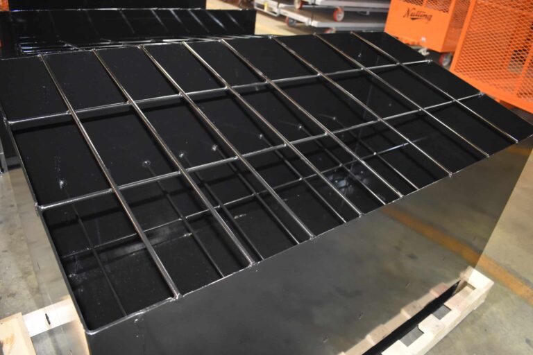 Steel rack organizing components for switchgear and panelboard production