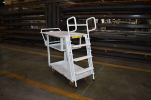 Industrial shelf ladder cart with spring-loaded 3-step ladder, steel construction, and 6 inch poly wheels