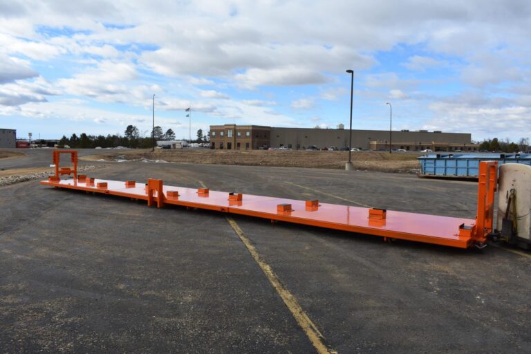 deck saddles positioning data center frame on heavy-duty transport cart