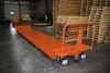 Low profile underslung trailer with tie down rings and solid pneumatic tires