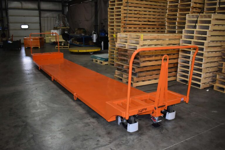 Low profile underslung trailer with tie down rings and solid pneumatic tires