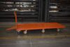 Aerospace pivot steer trailer with ergonomic poly wheels and floor lock