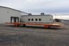 Large steel trailer transporting HVAC system for data center cooling