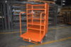 Steel order picking cart moving electrical supplies from racking to packing