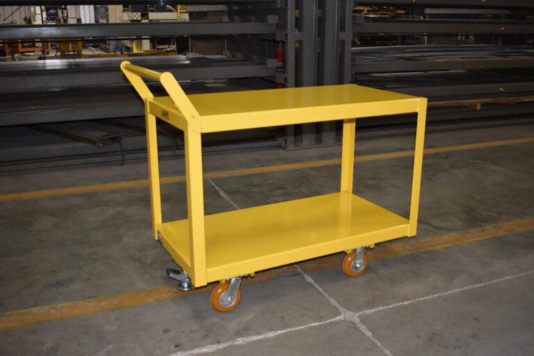 Steel two-tier shelf cart carrying automotive components through a doorway