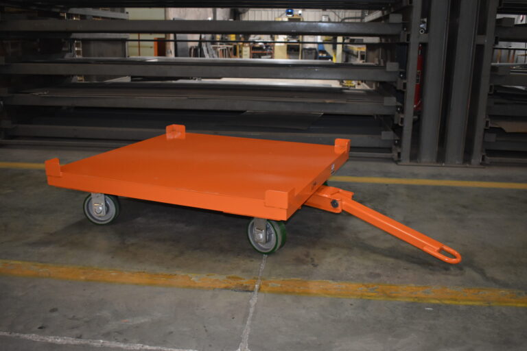 Z53-001-075 quad steer trailer towing a pallet across a food production floor