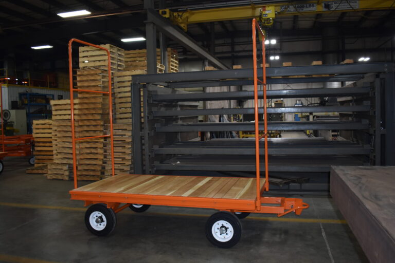 Wood deck fifth wheel steer trailer with automatic jaw and bail couplers