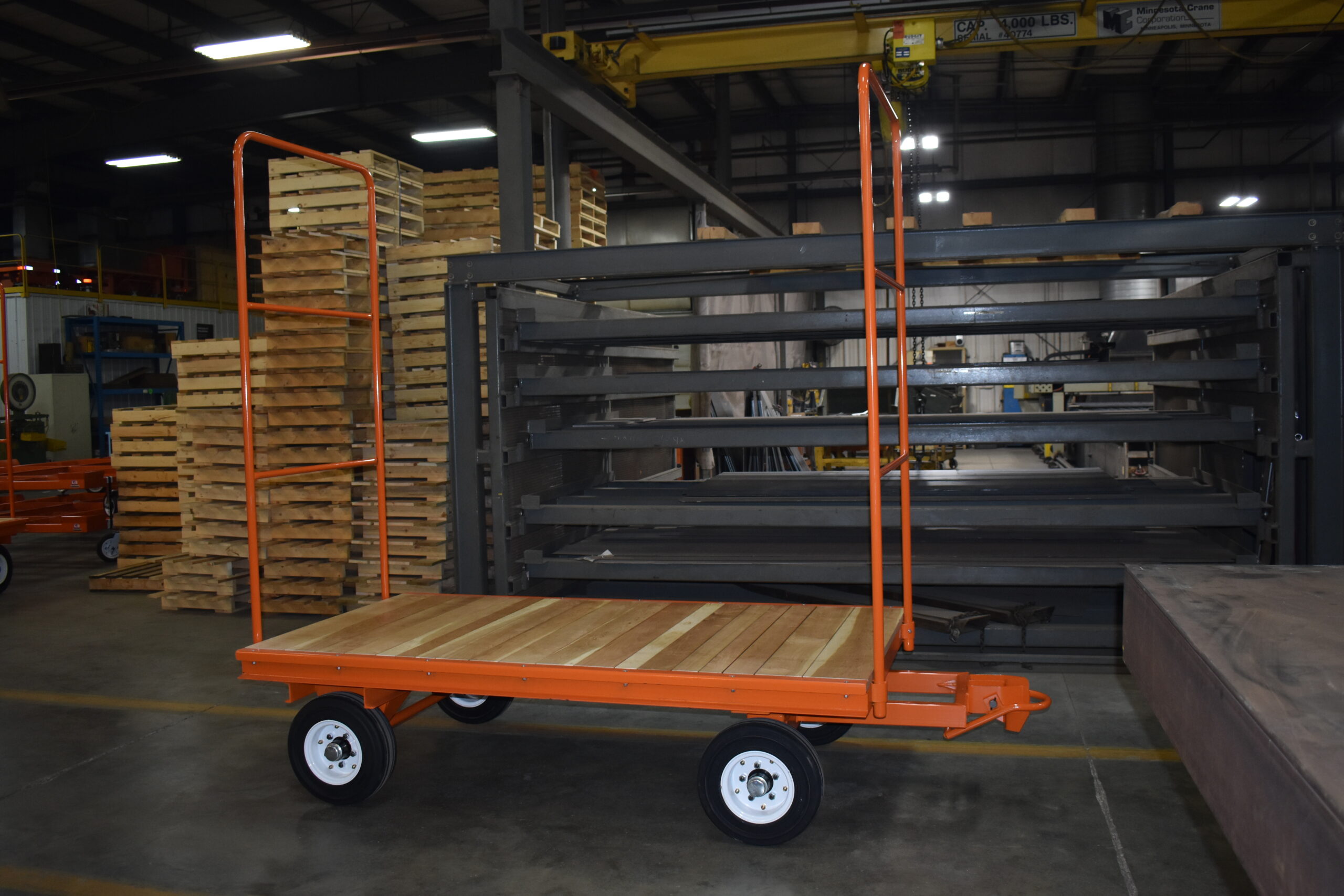 Wood deck fifth wheel steer trailer with automatic jaw and bail couplers